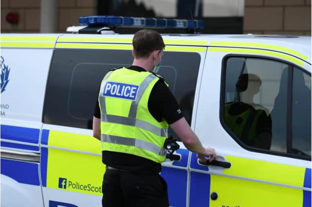 Police are appealing for information after a fire was set outside a shop in Livingston
