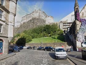 The stunning view of Edinburgh Castle from the Grassmarket is a a favourite spot for tourists taking photos.