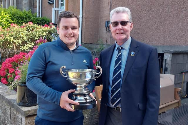 Anthony Blaney received his trophy from club captain Brian Gorman after claiming a second success in the Liberton championship