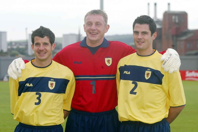 Stevie Crawford, Robert Douglas and Steven Thompson help launch Scotlands new away kit in October 2002