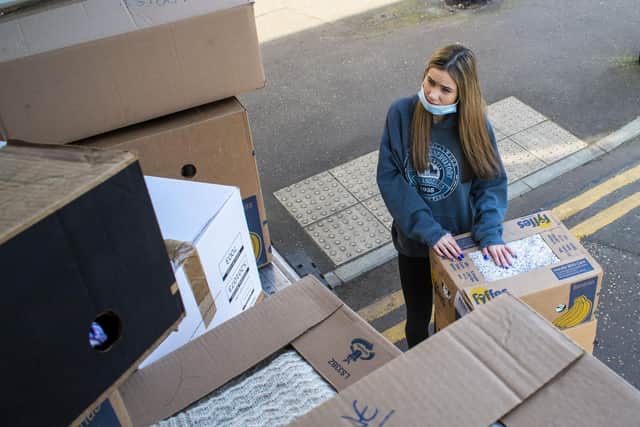 A volunteer helps load the lorry bound for Moldova. Picture: Lisa Ferguson