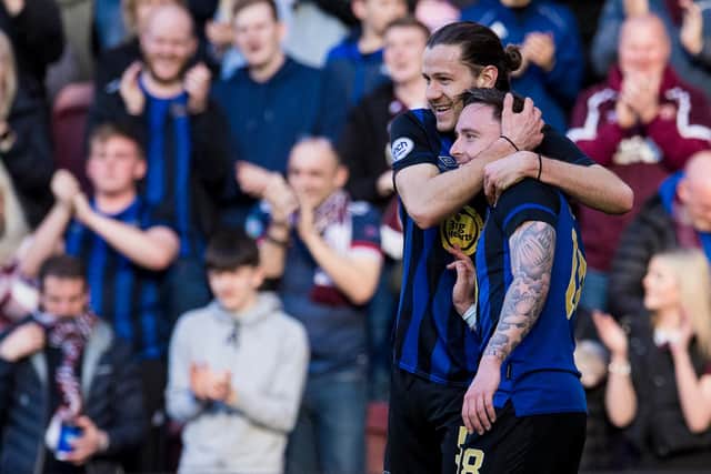 Peter Haring congratulates Barrie McKay after scoring his first goal for the club. Picture: SNS
