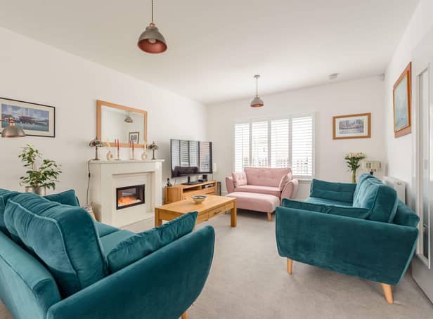 The welcoming living room has plenty of space for the family to relax together.