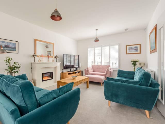 The welcoming living room has plenty of space for the family to relax together.