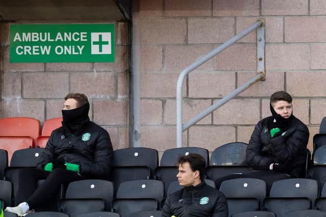 Hibs' Ryan Porteous (L) and Kevin Nisbet (R) were left on the bench against Dundee United after being linked with moves away from the club. Photo by Ross Parker / SNS Group