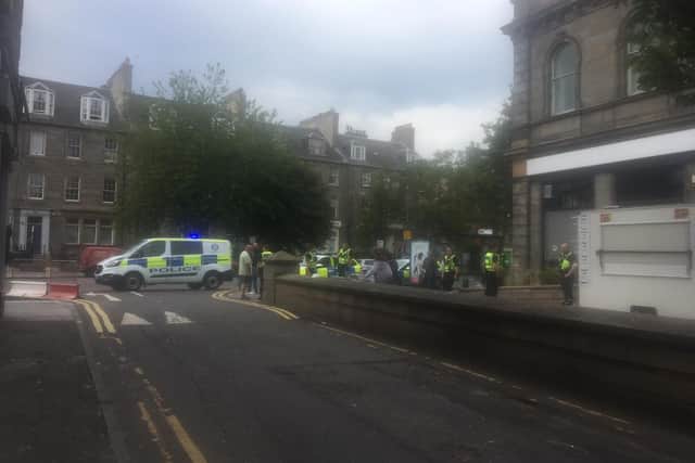 Police officers were seen speaking to people near a Tesco store in Leith.