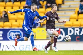 Hearts' Calem Nieuwenhof (R) and St Johnstone's Drey Wright in action. Pic: SNS