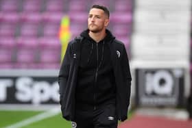 Hearts striker Conor Washington is waiting for news on his future.