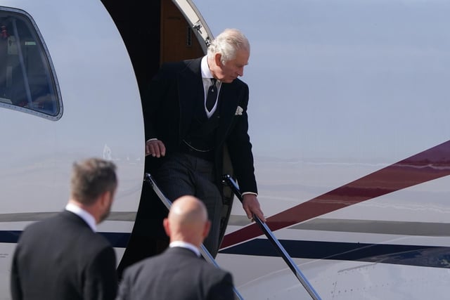 King Charles III arrives at Edinburgh Airport after travelling from London with the Queen Consort, ahead of joining the procession of Queen Elizabeth's coffin from the Palace of Holyroodhouse to St Giles' Cathedral, Edinburgh.