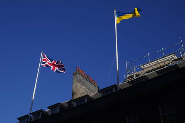 The Ukrainian flag being flown above 10 Downing Street in London. PA