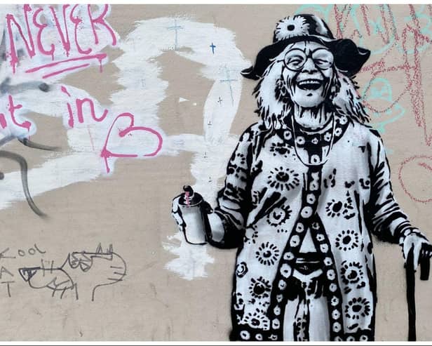 Edinburgh locals have been debating who inspired a new artwork that appeared on a building wall in Henderson Street.