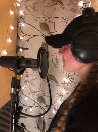 Madison Gardiner, 15, recording a song she wrote.