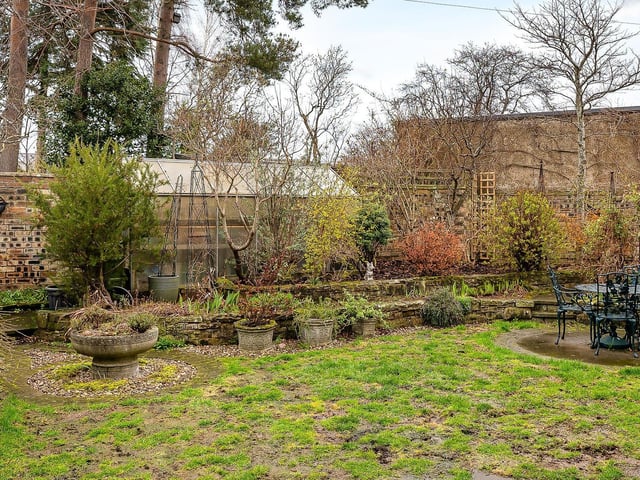 The property comes with this good-sized greenhouse in the garden which has power.