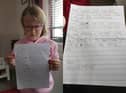 Seven year old Josslyn Miller with the letter she has sent to Cllr Derek Milligan.