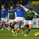 Rangers midfielder Joe Aribo battles with Joe Newell during the narrow 1-0 defeat Hibs suffered at Easter Road last time around. Picture: SNS