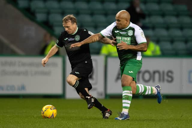 Mickey Weir and Kevin Harper battle for the ball during the charity match at Easter Road