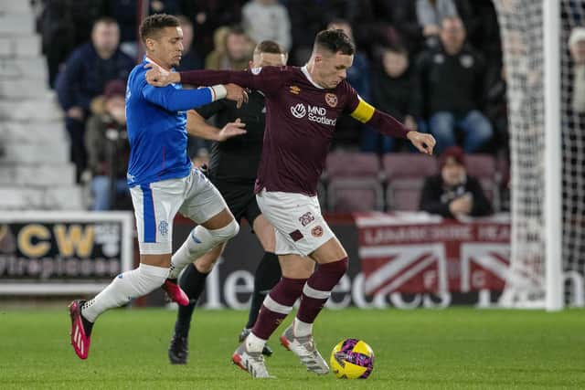 Hearts captain Lawrence Shankland and his Rangers counterpart James Tavernier at Tynecastle.