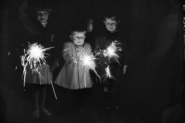Guy Fawkes Night - Fireworks - 2 year old Graham Chaney and brother Douglas with their sparklers, Edinburgh.