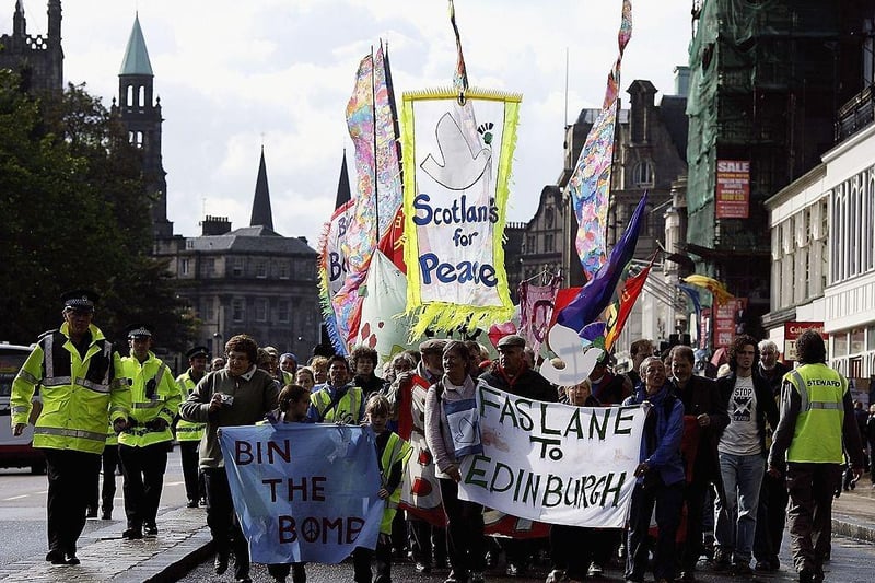 Anti-nuclear demonstrators march through Princes Street in Edinburgh to finish off their 85 mile walk from Faslane submarine base on the Clyde to the Scottish Parliament on 19 September 2006. The campaigners called for an end to Trident missiles and any proposed replacements.