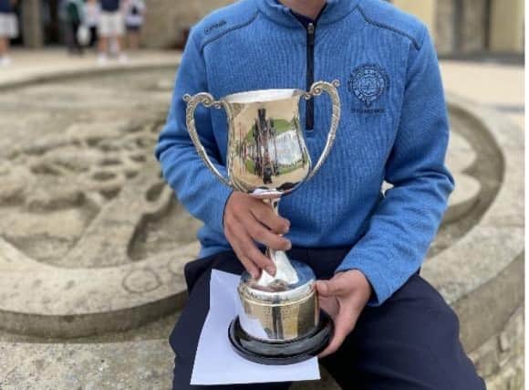 James Wood shows off the Carnoustie Junior Open trophy after his four-shot success in Angus. Picture: Carnoustie Golf Links