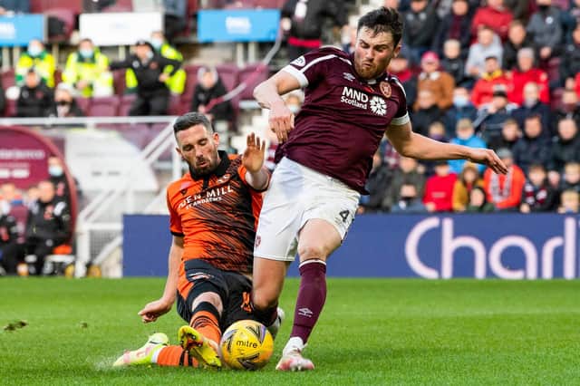 John Souttar gets the better of Nicky Clark in another superb display from the centre-back at Tynecastle. Picture: Ross Parker / SNS Group