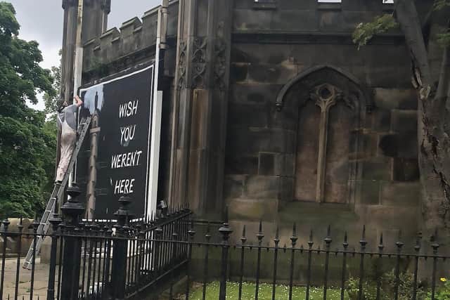 The picture carries a photograph of the Melville Monument, which has come under attack given its links to the slave trade, and features the words "Wish You Weren't Here".