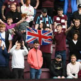 Hearts fans with a Union flag on the King's Coronation weekend, but it was Celtic who were crowned champions