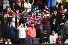 Hearts fans with a Union flag on the King's Coronation weekend, but it was Celtic who were crowned champions