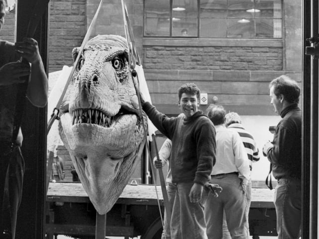 A giant Tyrannosaurus Rex head is unloaded by workmen for the Dinosaurs Alive! exhibition at the City Art Centre in Edinburgh, February 1990.