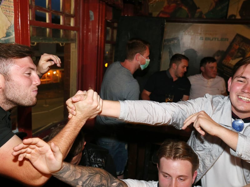 Celebrations at full-time. Fans watch England v Ukraine in the quarter finals of Euro 2020, in The Kings pub, Albert Rd, Southsea. Picture: Chris Moorhouse (jpns 030721-19)