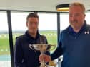 The Renaissance Club's Ross Noon, left, is presented with The Uniroyal Trophy by Edinburgh & East of Scotland Golfers' Alliance president Donny Munro after his win at Gullane.