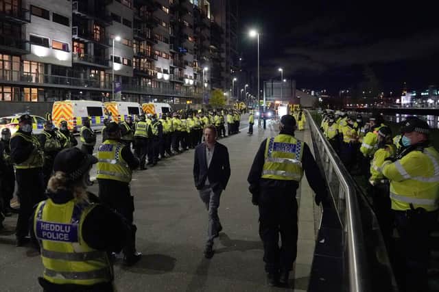 Welsh Police officers with colleagues from around the UK wait for protesters at the entrance of the Scottish Event Campus in Glasgow. Picture: Andrew Milligan/PA Wire