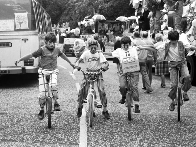 Boys on bicycle and unicycles take part in the Evening News sponsored Edinburgh Festival Cavalcade in August 1985