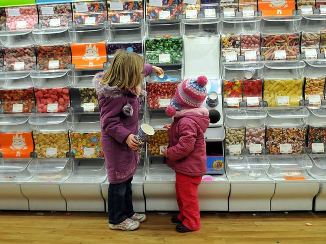 Children at the pick 'n' mix aisle on the last day of the Woolworths store at Leith before it closed for good in 2008.