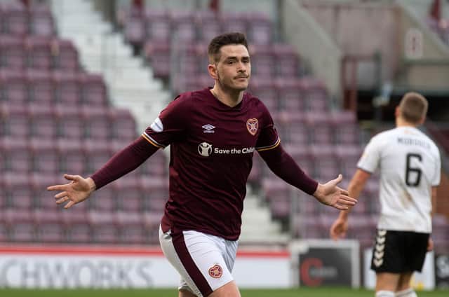 Hearts attacker Jamie Walker once again starts the game on the bench - an unpopular decision with the fans. Picture: SNS