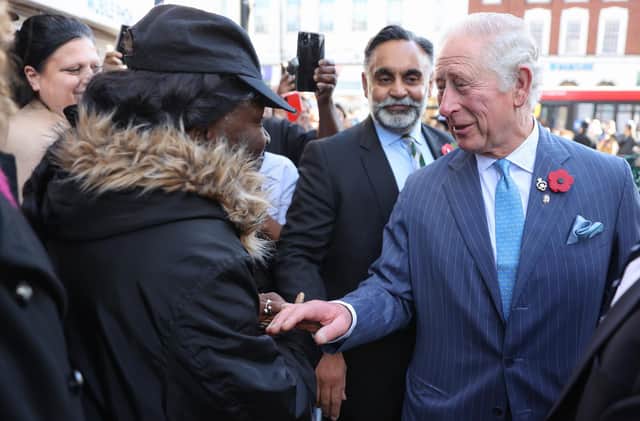 The Prince of Wales (right) meets members of the public as he departs a visit to meet Prince's Trust Young Entrepreneurs, supported through the Enterprise programme at NatWest, in London. Picture date: Thursday November 11, 2021.