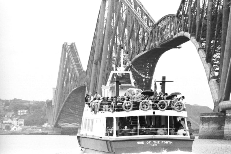 The Maid of the Forth ferry passes under the Forth bridge taking theatre-goers to Inchcolm island in the Firth of Forth for a special production of Macbeth during Edinburgh Festival 1989. Ferry overbooking meant organiser Richard Demarco faced disappointed  customers at South Queensferry.