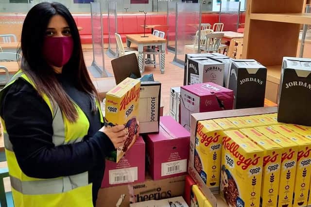Nadia Ahmed helping stock food parcels