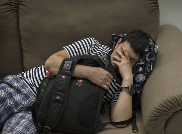 Many homeless people find themselves sleeping on couches or in other short-term forms of accommodation (Picture: Kevin Frayer/Getty Images)