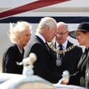King Charles III and the Queen Consort (left) are greeted by First Minister Nicola Sturgeon as they arrive at Edinburgh Airport after travelling from London, ahead of joining the procession of Queen Elizabeth's coffin from the Palace of Holyroodhouse to St Giles' Cathedral, Edinburgh. Picture date: Monday September 12, 2022.