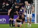 Robert Snodgrass struggles to get back to his feet after being fouled by Alex Gogic during a match between Hearts and St Mirren at Tynecastle Park. Picture: SNS