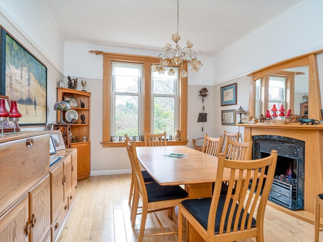 The dining room comes with a living-flame gas fire and original press (shelved cupboard).