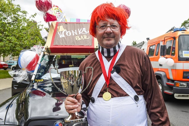 Brian Allan, who came along to the event dressed as an Oompa Loompa, proudly standing next to his award-winning taxi.