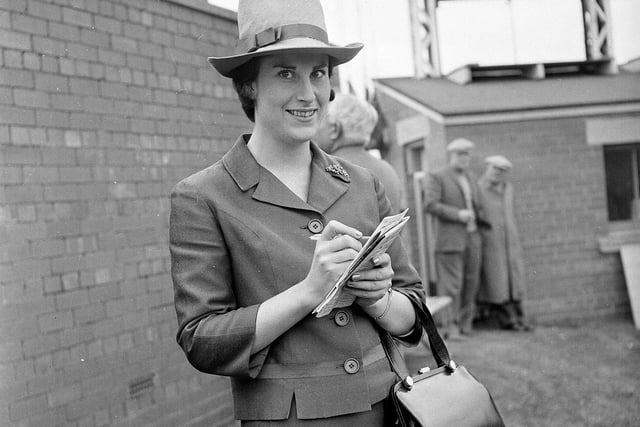 Miss W Walker in a shocking pink hat at Musselburgh Races in September 1964.