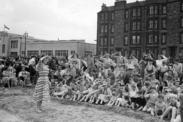 Children taking part in the 'action song' at the sea-side mission on Portobello Beach in July 1954