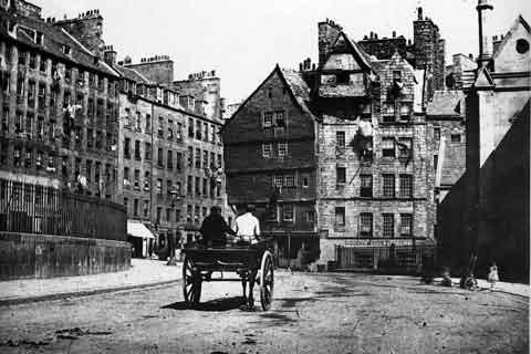 A horse and cart trundles towards Bowhead House and the Lawnmarket in the Old Town.