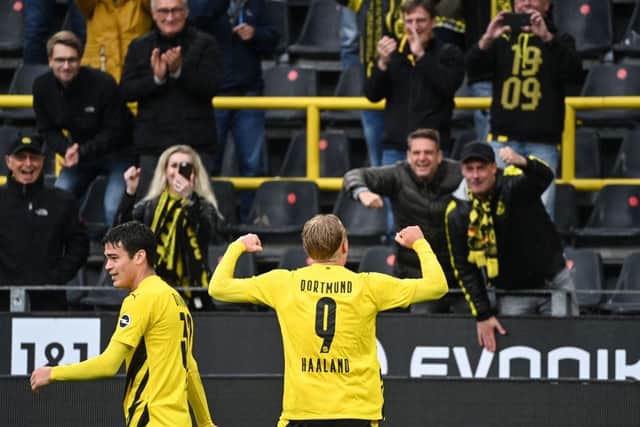 Dortmund's Norwegian forward Erling Braut Haaland celebrates with fans during a Bundesliga football match on October 3 before fresh Covid restrictions came into force. (Pic: Getty Images)