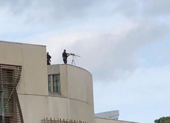 A sniper on top of the Scottish Parliament building.