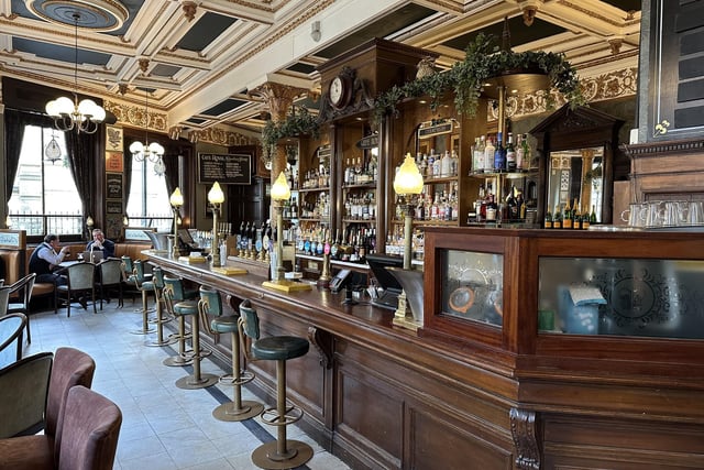 CAMRA says: Built in 1862 and a pub since 1901, the main Circle Bar has a white marble floor, panelled dado, foliate Rococo-style frieze and delightful compartmented ceiling.