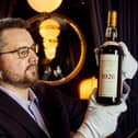 Whisky auctioneer founder Iain Mcclune with the 'Holy Grail' Macallan